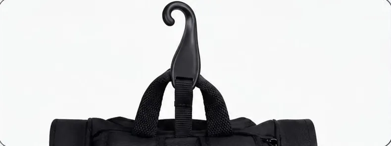Black fence hook attached to the bag's top handle