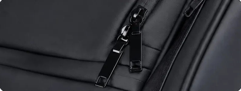 Close-up of black metal zipper pulls